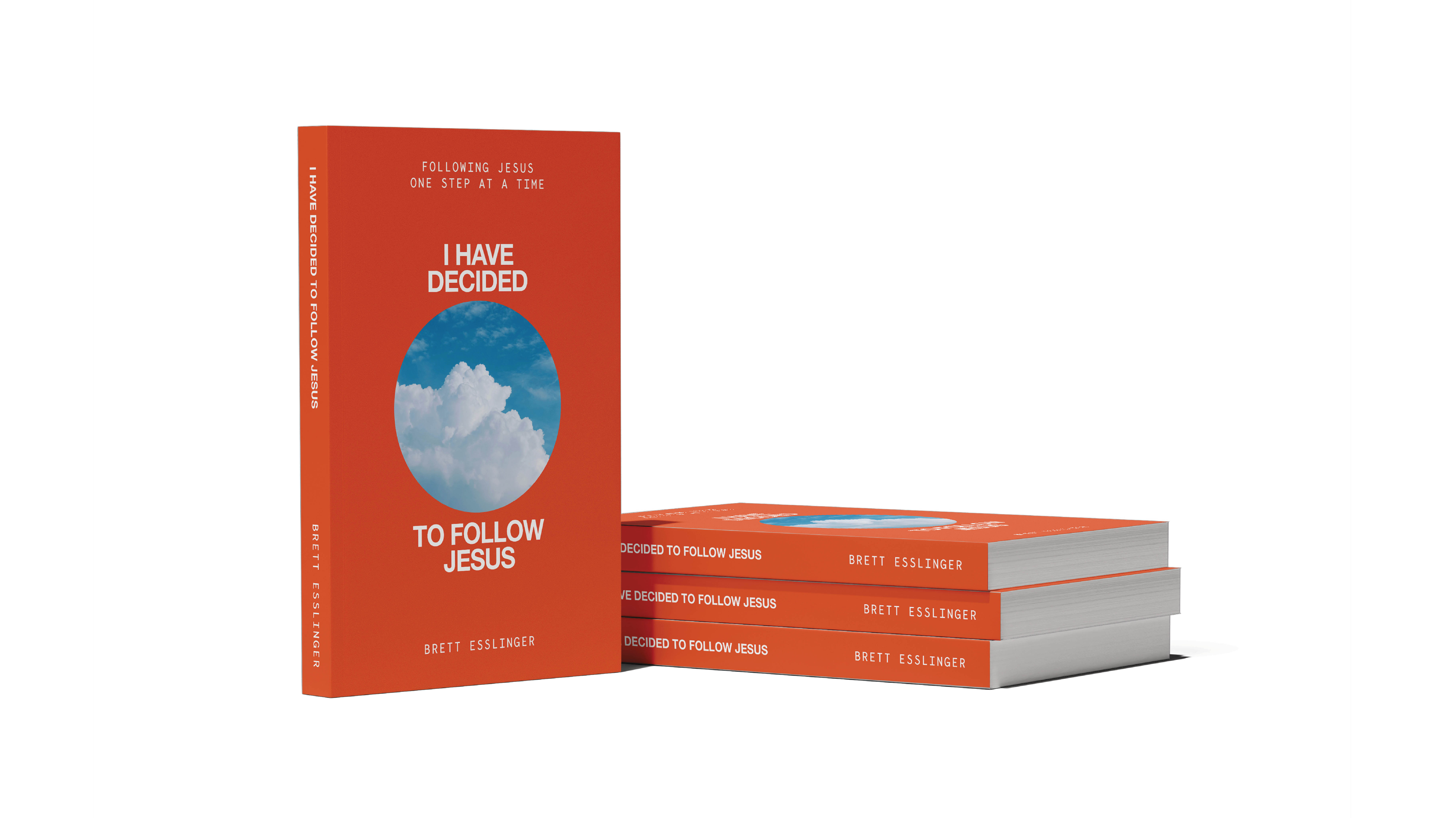 I Have Decided to Follow Jesus book standing beside a stack of copies